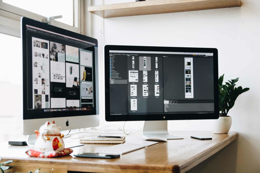 Web designer working space with two monitors for graphic design and web services